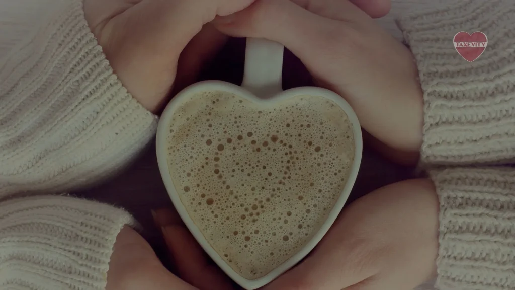 A heart-shaped cup of coffee held lovingly by two philanthropic hands.