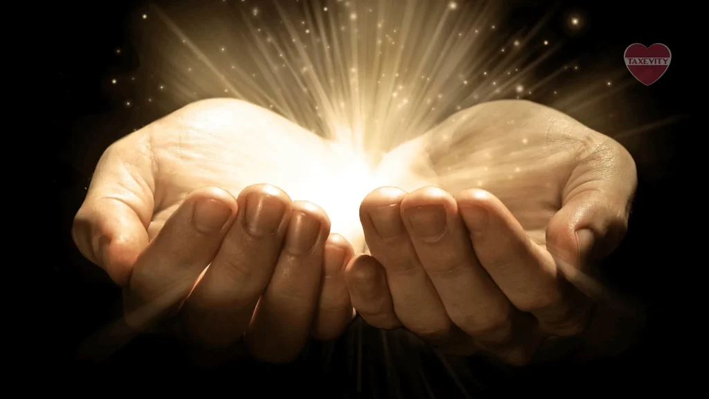 Two philanthropic hands with a shining light, embodying the spirit of giving.